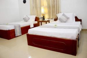 Letto o letti in una camera di Siem Reap Comforts Hostel