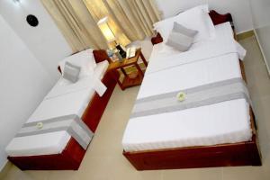 Letto o letti in una camera di Siem Reap Comforts Hostel