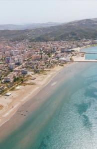 an aerial view of a beach and the ocean at Arlind's Apartaments in Vlorë
