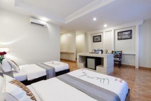 Letto o letti in una camera di Siem Reap Comforts Hostel