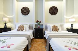 Letto o letti in una camera di Siem Reap Comforts Hostel