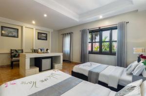 Letto o letti in una camera di Siem Reap Comforts Hostel