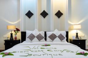 Letto o letti in una camera di Siem Reap Comforts Hostel