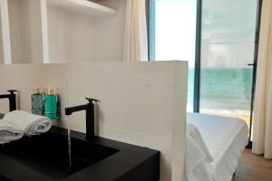 Postel nebo postele na pokoji v ubytování Ancón Suites