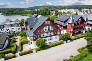 an aerial view of a town with a river and houses at Seehof Seehof 2 0 in Bansin