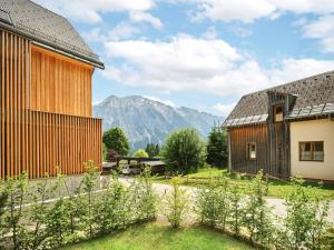 a view of the mountains from the courtyard of a house at Mountain Lover one by AA Holiday Homes in Tauplitz