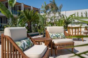 two chairs and a table on a patio at Mirada Exclusive Bodrum in Bodrum City
