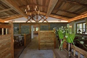 a large room with wooden walls and a chandelier at Apartment Schichlreit in Annaberg im Lammertal