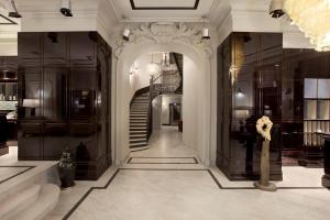a hallway with a staircase in a building at Astoria Hotel in Lviv