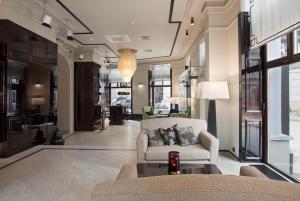a living room with a couch and a table at Astoria Hotel in Lviv