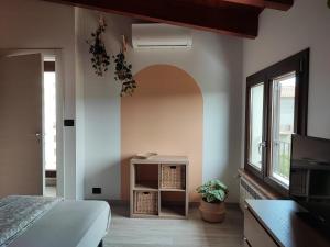 a bedroom with a bed and a window at Desideria Rooms Bed and Breakfast in Torino di Sangro