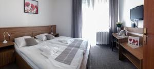 Postel nebo postele na pokoji v ubytování Restavracija in prenočišča ČARDA