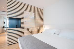 Unique Rooms客房内的一张或多张床位
