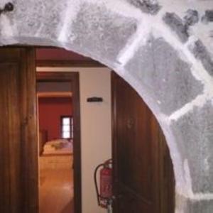 a view of a room with a door and a bedroom at Yono's Traditional House in Ano Ravenia