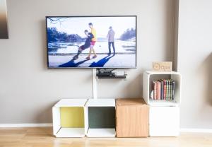 En tv och/eller ett underhållningssystem på Klostergaarden leilighetshotell