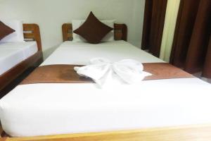 Postel nebo postele na pokoji v ubytování Tenzai Homestay