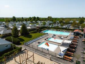 an aerial view of a pool at a resort at Glamping Kamperland in Kamperland