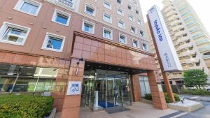 a building with a sign in front of it at Toyoko Inn Keio sen Hashimoto eki Kita guchi in Sagamihara +27 photos