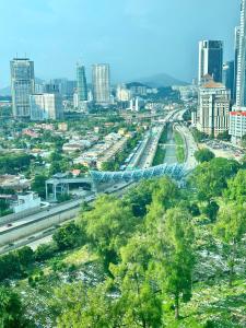 a view of a city with a highway and buildings at Comfy+ by ARH KLCC in Kuala Lumpur