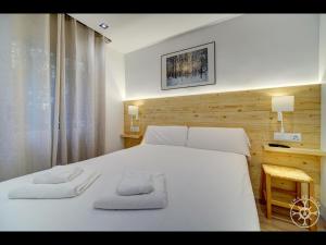 A bed or beds in a room at MONTLUDE de Alma de Nieve