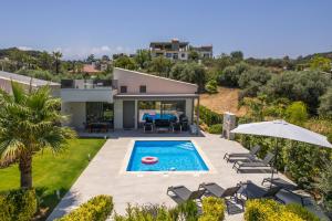 an aerial view of a villa with a swimming pool at Ethereal Villas Chania in Daratso