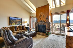 a living room with a couch and a fireplace at Cozy Condo with Balcony and Mtn View in Silverthorne! in Silverthorne