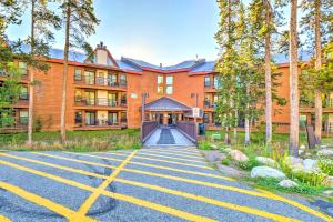 a large orange building with a driveway in front of it at Cozy Condo with Balcony and Mtn View in Silverthorne! in Silverthorne