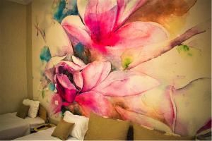 a painting of a pink flower on a wall at AyaSofiA Suite HOT TUB- JAKUZZI, balcons 2 rooms and 1 luxury Studio in Thessaloniki