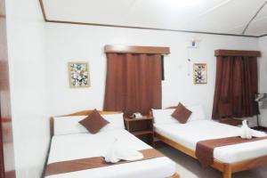 Postel nebo postele na pokoji v ubytování Tenzai Homestay