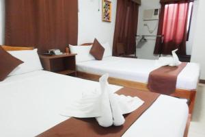 Postel nebo postele na pokoji v ubytování Tenzai Homestay