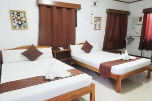Postel nebo postele na pokoji v ubytování Tenzai Homestay