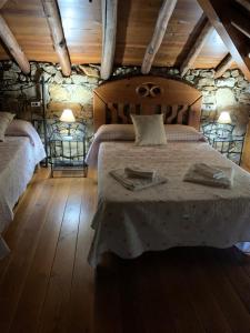 Postelja oz. postelje v sobi nastanitve Casa Rural Allá Bajo