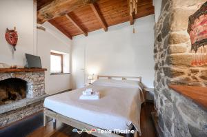 Postel nebo postele na pokoji v ubytování L'Occhio di Santa Lucia, Terre Marine