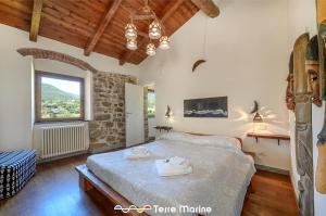 Postel nebo postele na pokoji v ubytování L'Occhio di Santa Lucia, Terre Marine