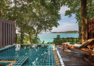 a swimming pool with a view of the water at Captain Hook Resort @Koh Kood in Ko Kood
