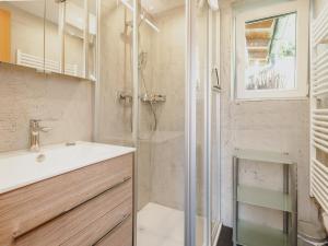 a bathroom with a shower and a sink at Apartment Bauernhof Birkhöfl by we rent in Zell am See +49 photos