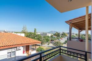 a balcony with a view of a street at Urban Apt Next University 14 in Heraklio
