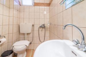 a bathroom with a shower with a toilet and a sink at Urban Apt Next University 14 in Heraklio +12 photos