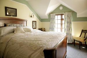 En eller flere senge i et værelse på Marsh Mere Lodge