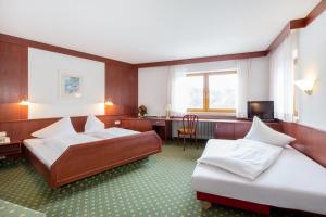 Postel nebo postele na pokoji v ubytování Hotel Jägerhaus