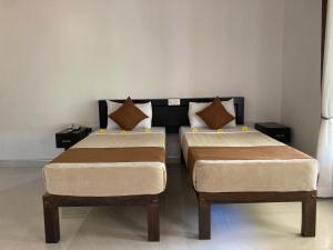 Llit o llits en una habitació de The View Hotel Sigiriya