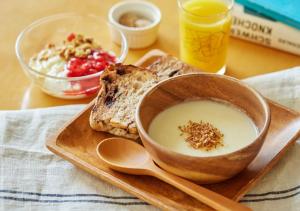 a plate of food with a bowl of soup and bread at Hotel Graphy Nezu in Tokyo