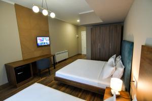 Postel nebo postele na pokoji v ubytování Gelati Residence