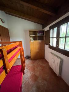 a bedroom with two bunk beds in a room at La casa nell'oliveto in Berchidda