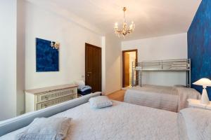 Postel nebo postele na pokoji v ubytování B&B Luna