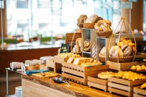 a display of bread and pastries in a bakery at Sheraton Nha Trang Hotel & Spa in Nha Trang