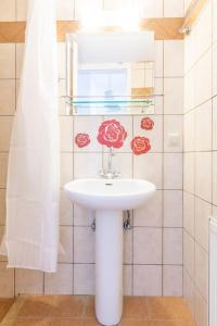 a bathroom with a white sink and a mirror at Urban Apt Next University 4 in Heraklio Town