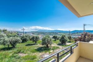 a view from the balcony of a house with olive trees at Urban Apt Next University 15 in Heraklio