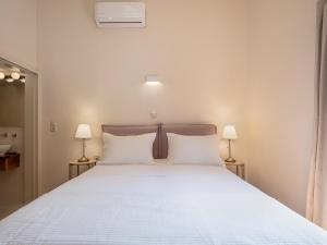 Postel nebo postele na pokoji v ubytování Faedra Residence