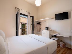 Postel nebo postele na pokoji v ubytování Faedra Residence